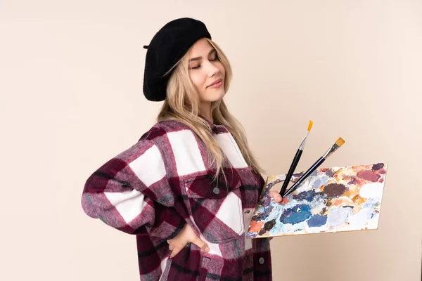 Adolescente Artista Chica Sosteniendo Una Paleta Aislada Sobre Fondo Azul —  Fotos de Stock