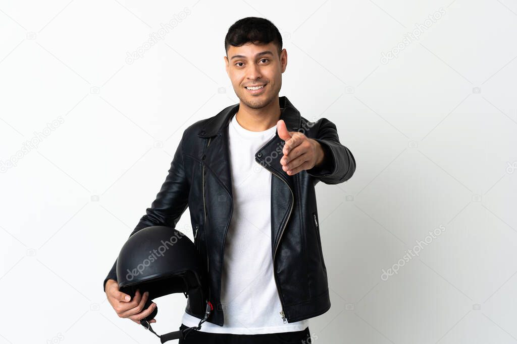 Man with a motorcycle helmet isolated on white background shaking hands for closing a good deal