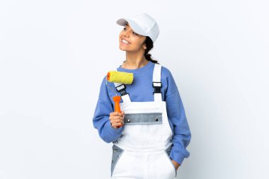 Painter woman over isolated white background looking side