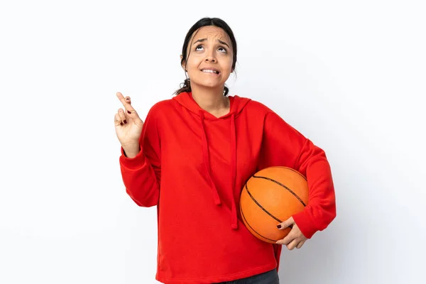 Young Woman Playing Basketball Isolated White Background Fingers Crossing Wishing — ストック写真
