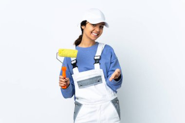 Painter woman over isolated white background shaking hands for closing a good deal