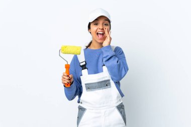 Painter woman over isolated white background shouting with mouth wide open