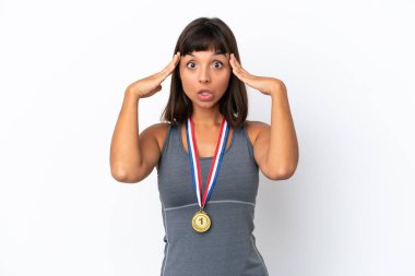 Young mixed race woman with medals isolated on white background with surprise expression