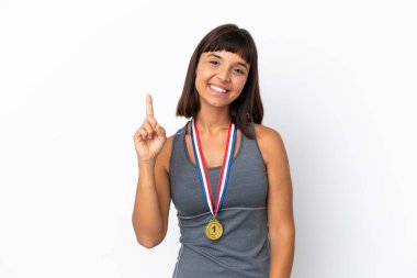 Young mixed race woman with medals isolated on white background showing and lifting a finger in sign of the best