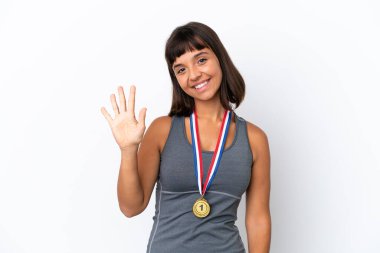 Young mixed race woman with medals isolated on white background counting five with fingers
