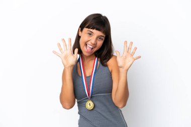 Young mixed race woman with medals isolated on white background counting ten with fingers