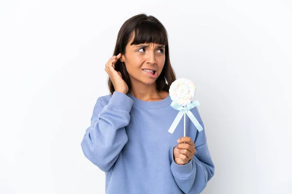Young Mixed Race Woman Holding Lollipop Isolated White Background Frustrated — Stockfoto