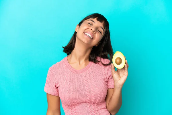 Young Mixed Race Woman Holding Avocado Isolated Blue Background Laughing — Stockfoto