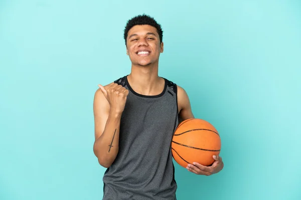 Basketball Player African American Man Isolated Blue Background Pointing Side — Stock Fotó