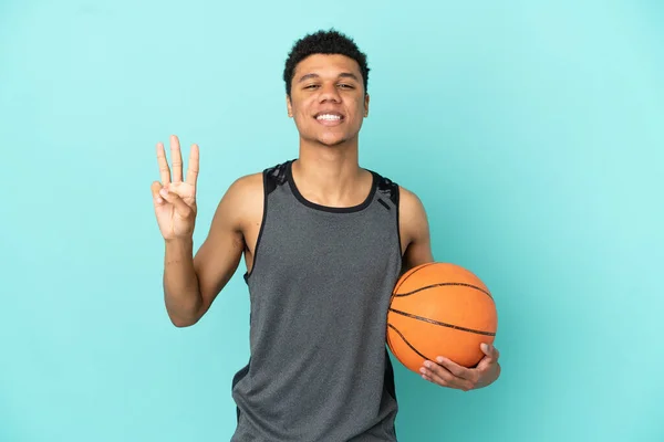 Basketbalista Afroameričan Izolovaný Modrém Pozadí Šťastný Počítání Tři Prsty — Stock fotografie