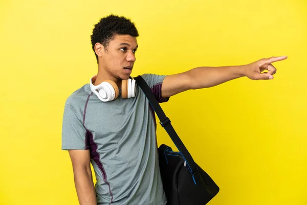 Young Sport African American Man Sport Bag Isolated Yellow Background — стокове фото