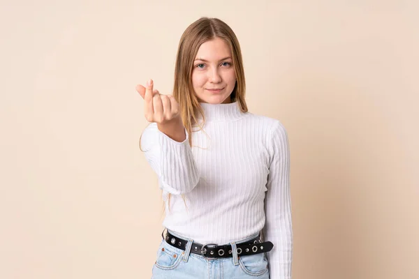 Teenager Ουκρανικό Κορίτσι Απομονώνονται Μπεζ Φόντο Κάνοντας Χειρονομία Χρήματα — Φωτογραφία Αρχείου