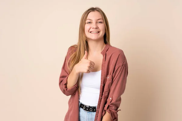 Teenager Ukrainisches Mädchen Isoliert Auf Beigem Hintergrund Gibt Eine Daumen — Stockfoto