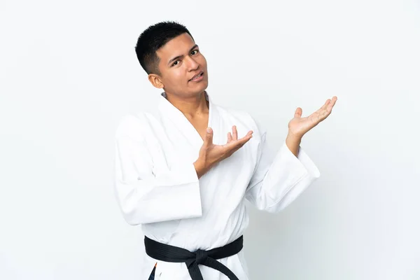 Joven Ecuatoriano Haciendo Karate Aislado Sobre Fondo Blanco Extendiendo Las —  Fotos de Stock