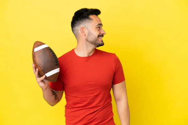 Young Caucasian Man Playing Rugby Isolated Yellow Background Laughing Lateral — Stock Photo, Image