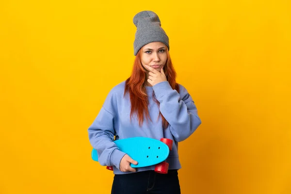Teenager Russian Skater Girl Isolated Yellow Background Thinking — стокове фото
