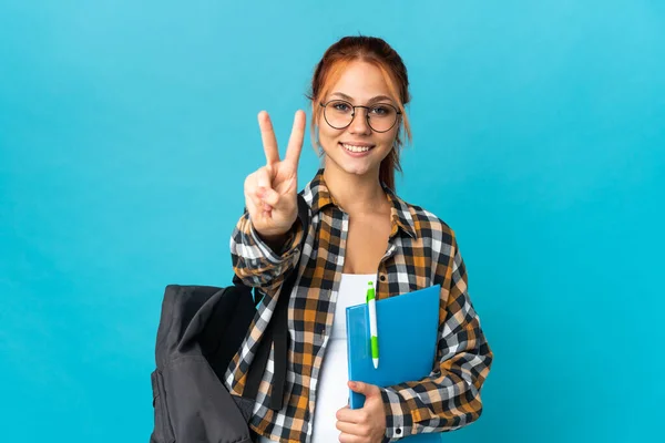 Adolescente Estudiante Ruso Chica Aislado Azul Fondo Sonriendo Mostrando Signo — Foto de Stock