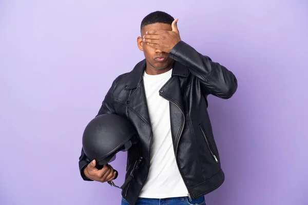 Latin Man Motorcycle Helmet Isolated Purple Background Covering Eyes Hands — Foto Stock