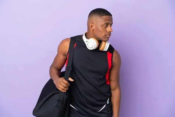 Young Sport Latin Man Sport Bag Isolated Purple Background Looking — Fotografia de Stock