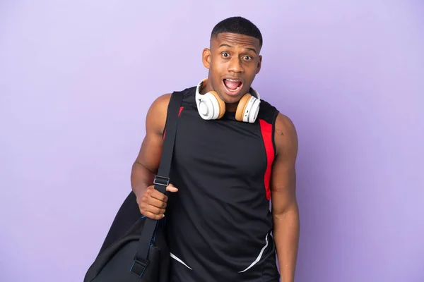 Young Sport Latin Man Sport Bag Isolated Purple Background Surprise — 图库照片