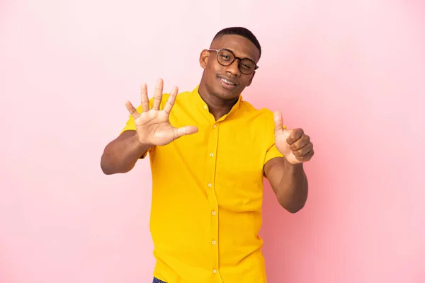 Young Latin Man Isolated Pink Background Counting Six Fingers — Stockfoto