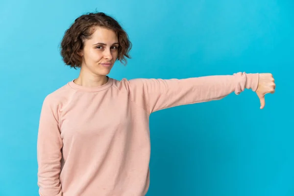 Young English Woman Isolated Blue Background Showing Thumb Negative Expression — Stockfoto