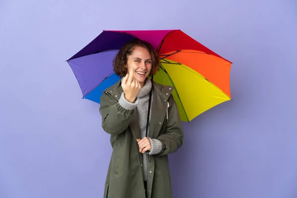 English Woman Holding Umbrella Isolated Purple Background Doing Coming Gesture — 图库照片