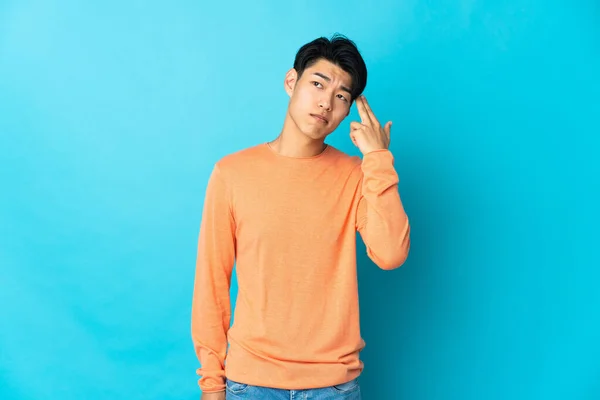 Young Chinese Man Isolated Blue Background Problems Making Suicide Gesture — Stok fotoğraf