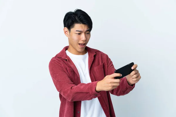 Young Chinese Man Isolated White Background Playing Mobile Phone — Stock Fotó