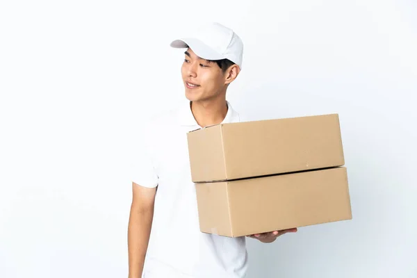 Delivery Chinese Man Isolated White Background Looking Side Smiling — Stock Photo, Image