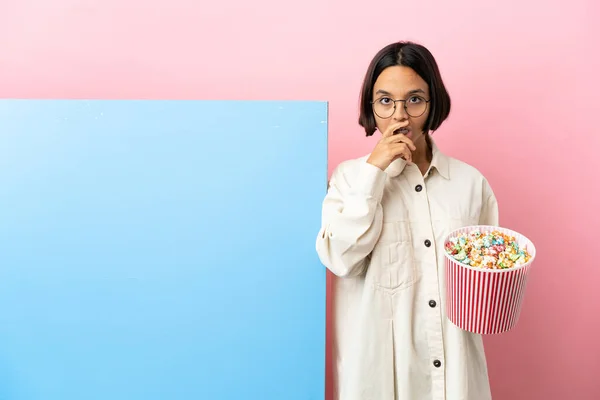Young Mixed Race Woman Holding Popcorns Big Banner Isolated Background — Stockfoto