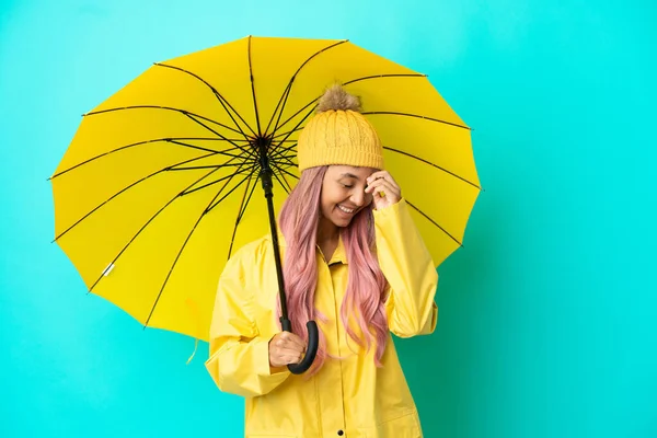 Young Mixed Race Woman Rainproof Coat Umbrella Laughing — Stockfoto