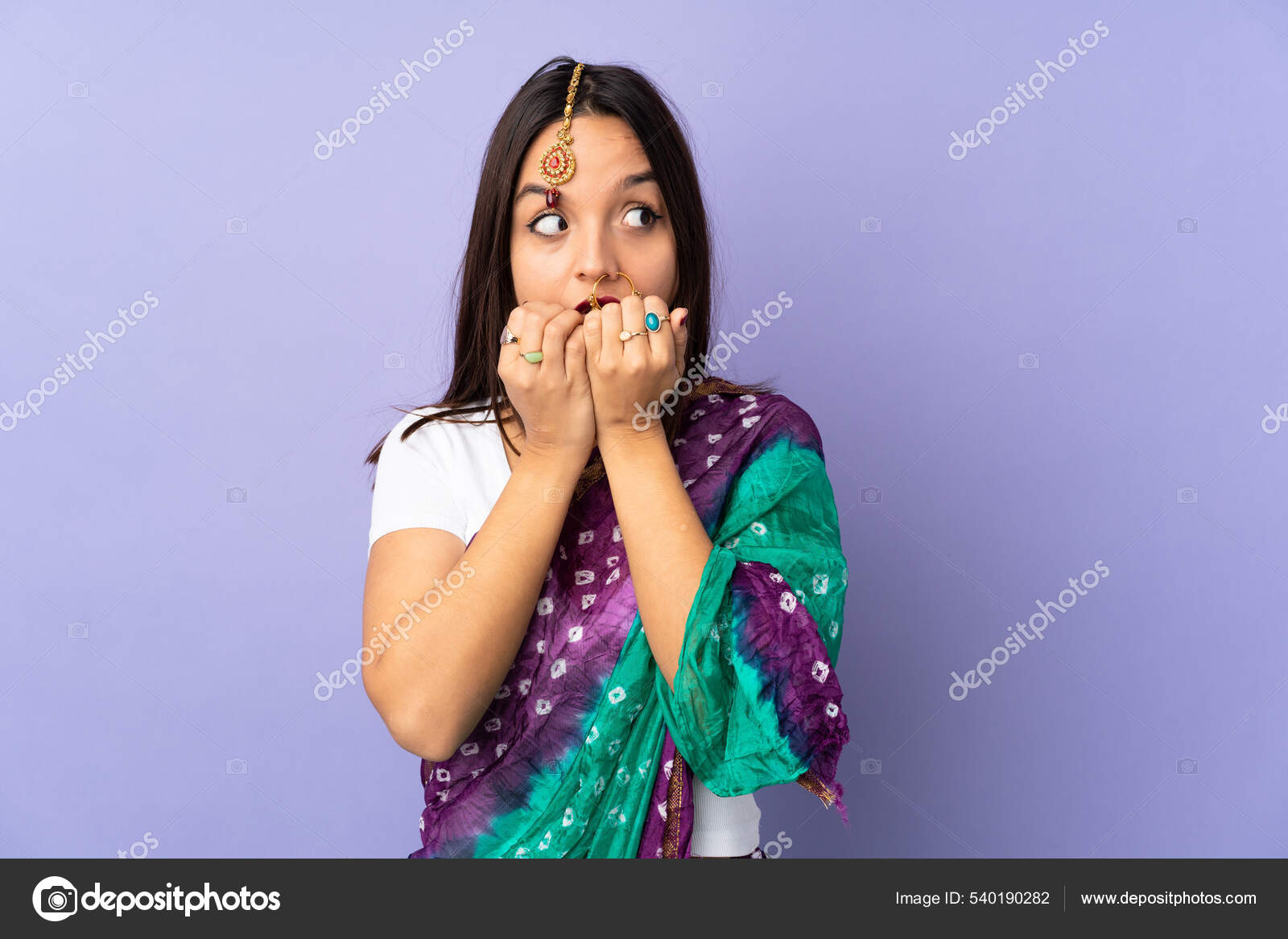 Scared, worry and face of Indian woman on pink background with