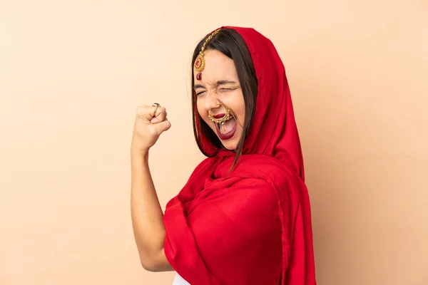 Young Indian Woman Isolated Beige Background Celebrating Victory — Stock Photo, Image