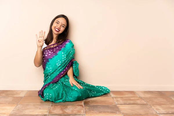 Young Indian Woman Sitting Floor Happy Counting Four Fingers — Fotografia de Stock