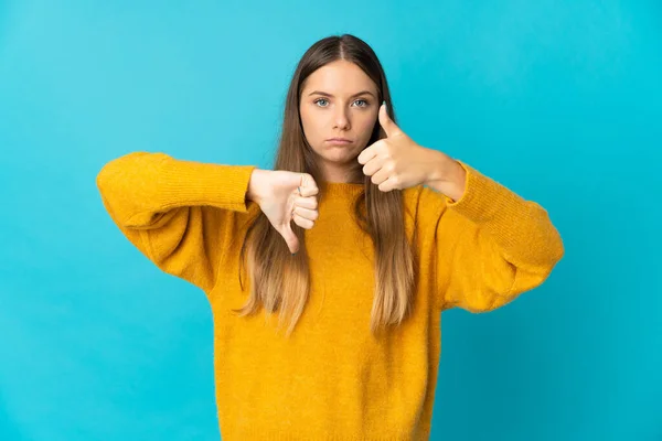 Young Lithuanian Woman Isolated Blue Background Making Good Bad Sign — ストック写真
