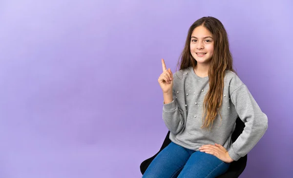 Little Caucasian Girl Sitting Chair Isolated Purple Background Showing Lifting — 스톡 사진