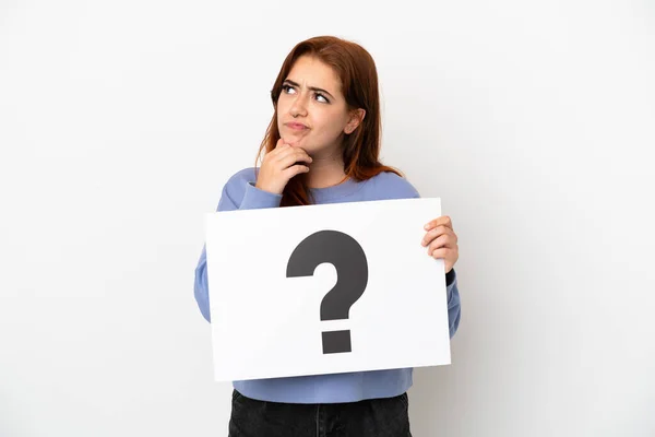 Young Redhead Woman Isolated White Background Holding Placard Question Mark — Stockfoto