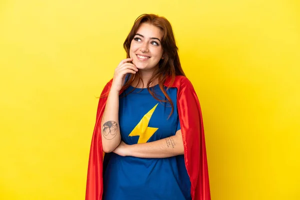Super Hero Redhead Woman Isolated Yellow Background Thinking Idea While — Zdjęcie stockowe