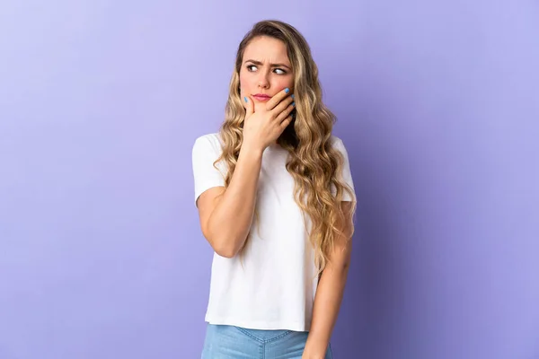 Young Brazilian Woman Isolated Purple Background Having Doubts Confuse Face — стоковое фото