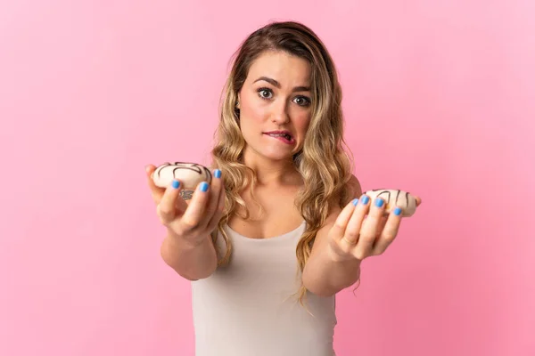 Young Brazilian Woman Isolated Pink Background Holding Donut Sad — стокове фото