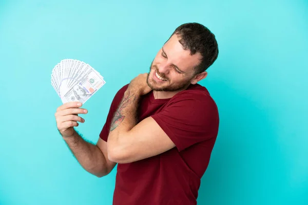 Young Brazilian Man Taking Lot Money Isolated Background Suffering Pain — стоковое фото