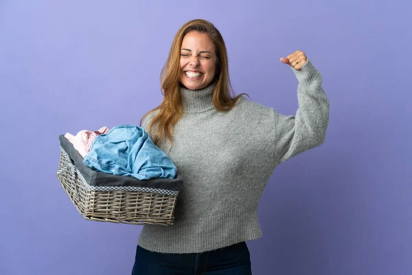 Middle Age Woman Holding Clothes Basket Isolated Purple Background Doing — 图库照片
