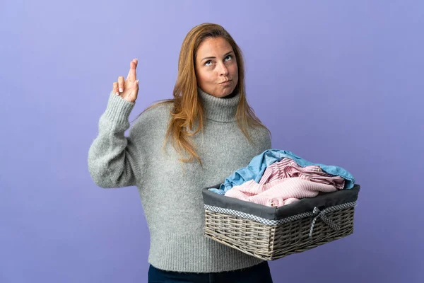 Middle Age Woman Holding Clothes Basket Isolated Purple Background Fingers — Stock Fotó