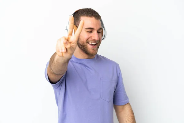 Young Handsome Caucasian Man Isolated White Background Listening Music Singing — Stock Fotó