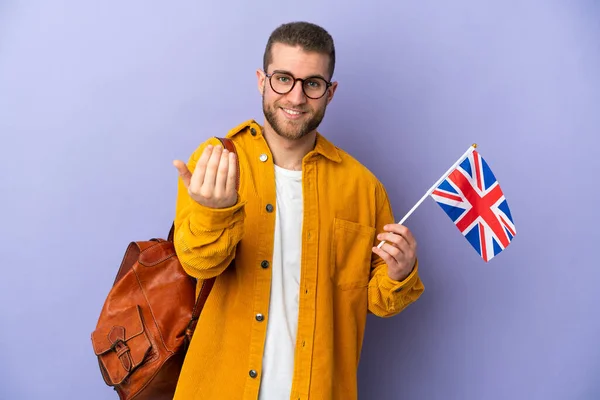 Young Caucasian Man Holding United Kingdom Flag Isolated Purple Background — Zdjęcie stockowe