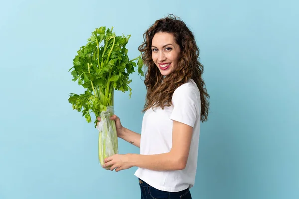 Young Woman Holding Celery Isolated Blue Background Smiling Lot — Foto Stock