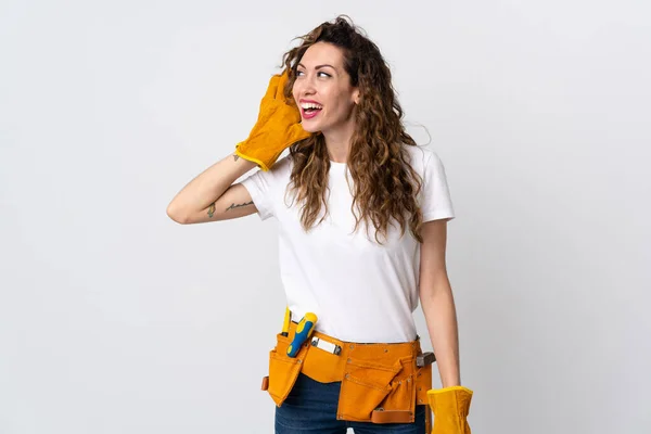 Young Electrician Man Isolated White Background Listening Something Putting Hand — Zdjęcie stockowe