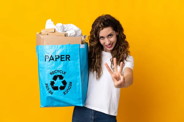 Young Woman Holding Recycling Bag Full Paper Recycle Isolated Yellow — Stockfoto