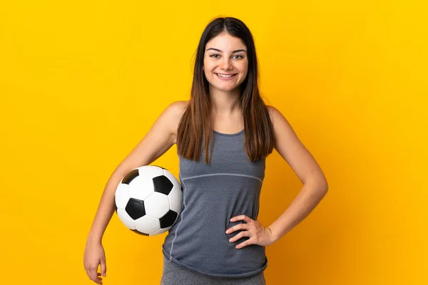 Young Football Player Woman Isolated Yellow Background Posing Arms Hip — Stockfoto